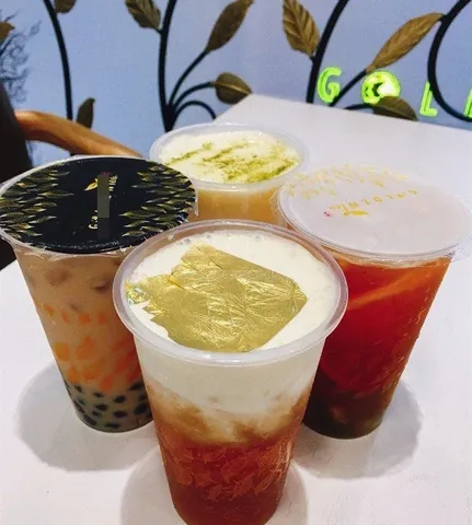 Trà Sữa Dát Vàng: Khám Phá Hương Vị Sang Trọng & Ý Nghĩa Tài Lộc Trà Sữa Dát Vàng: Khám Phá Hương Vị Sang Trọng & Ý Nghĩa Tài Lộc